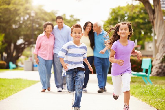 Children running ahead of their family